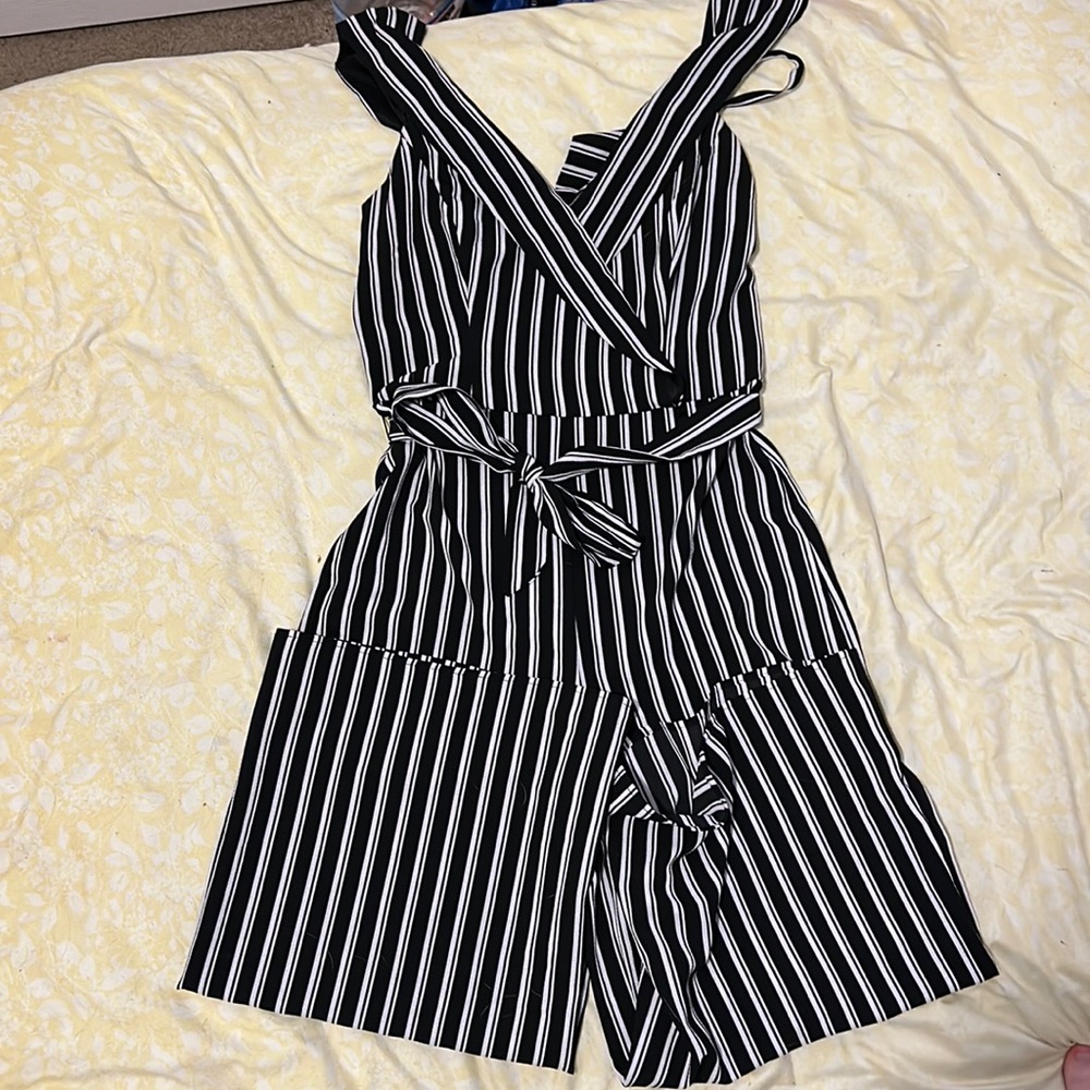 Black and white striped jumpsuit.